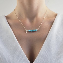 De turquoise staafketting van de vrouw