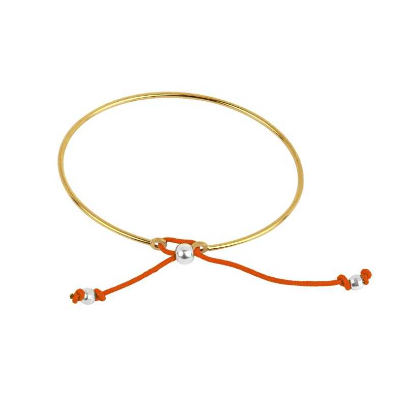 De vergulde slavenarmband van de vrouw De vergulde slavenarmband van de vrouw