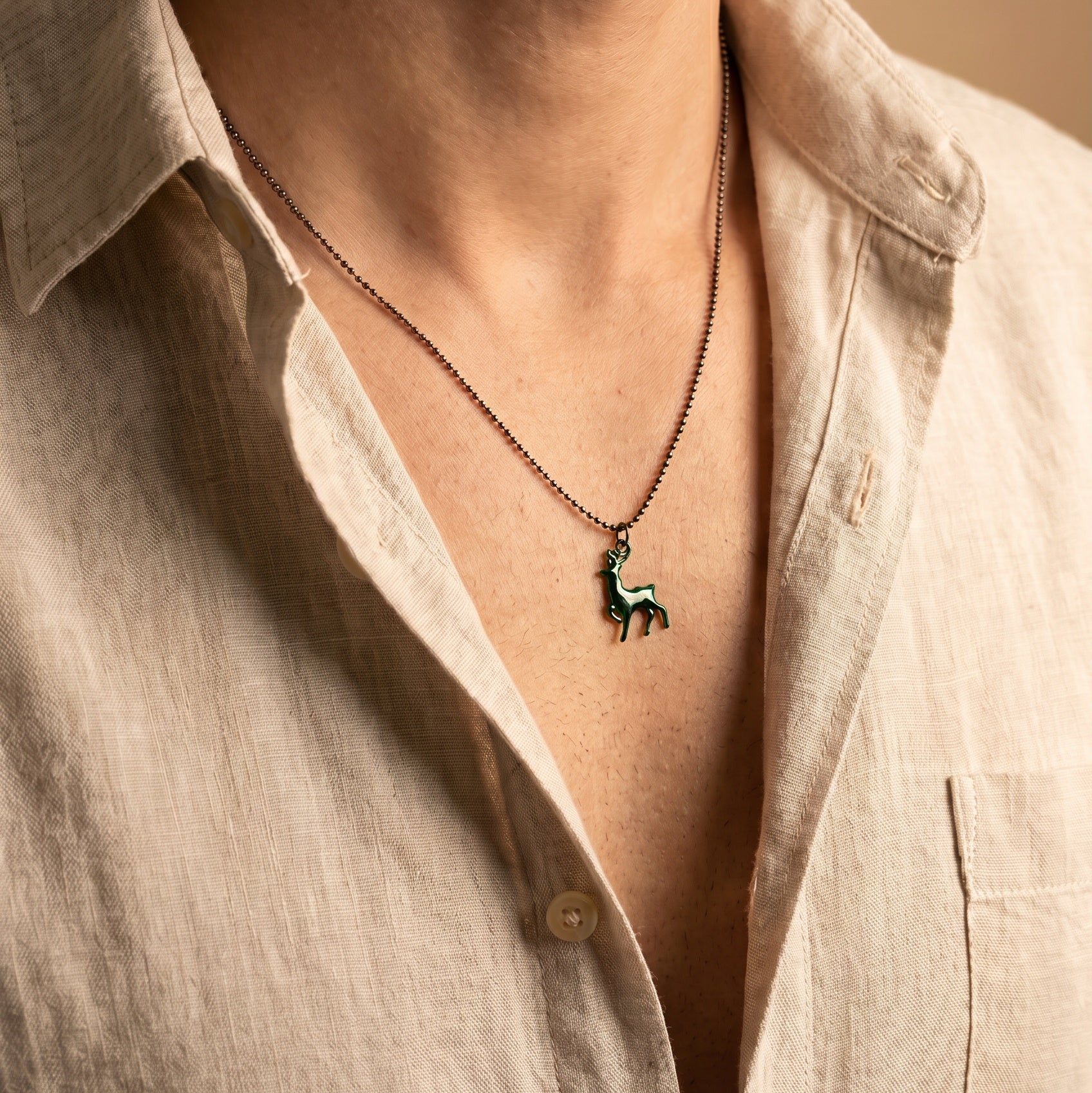 Herenketting met groene emaille en een hert