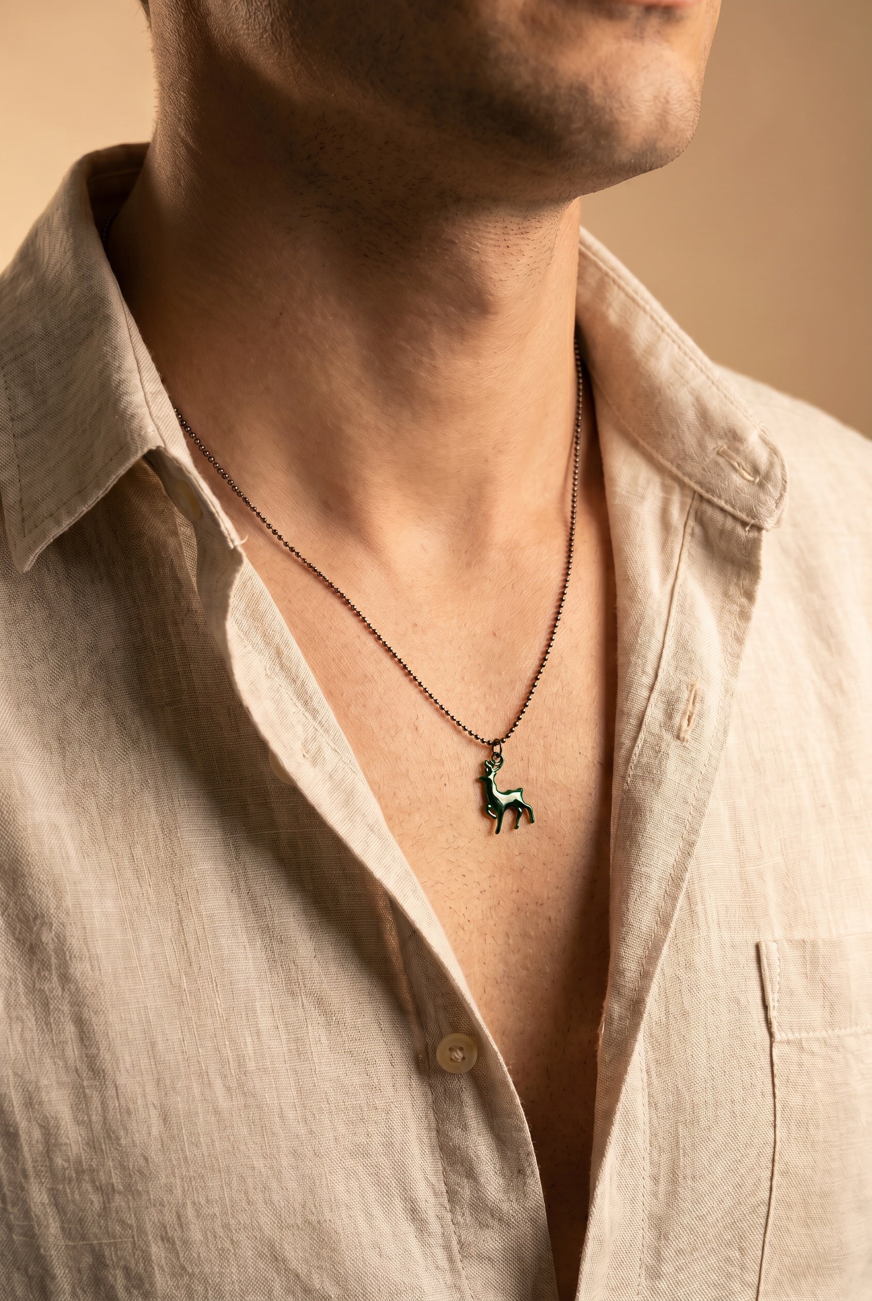 Men's green enamel deer necklace