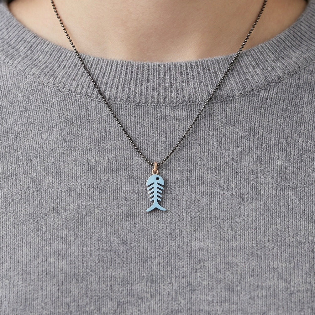 Silver and blue enamel fish pendant for a young girl
