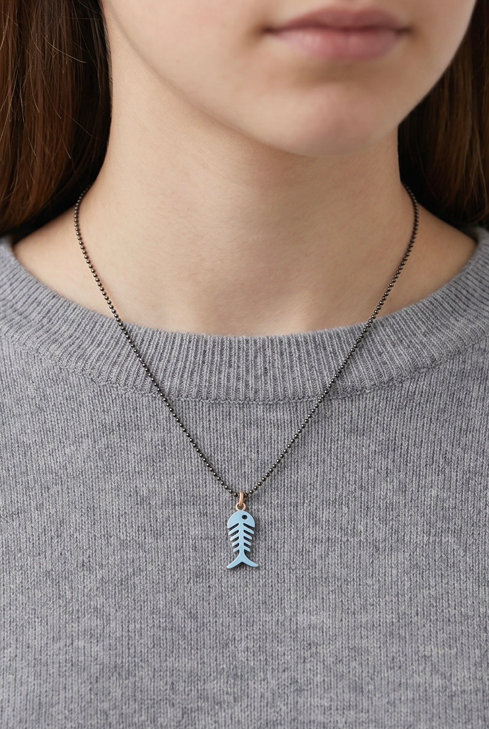 Silver and blue enamel fish pendant for a young girl