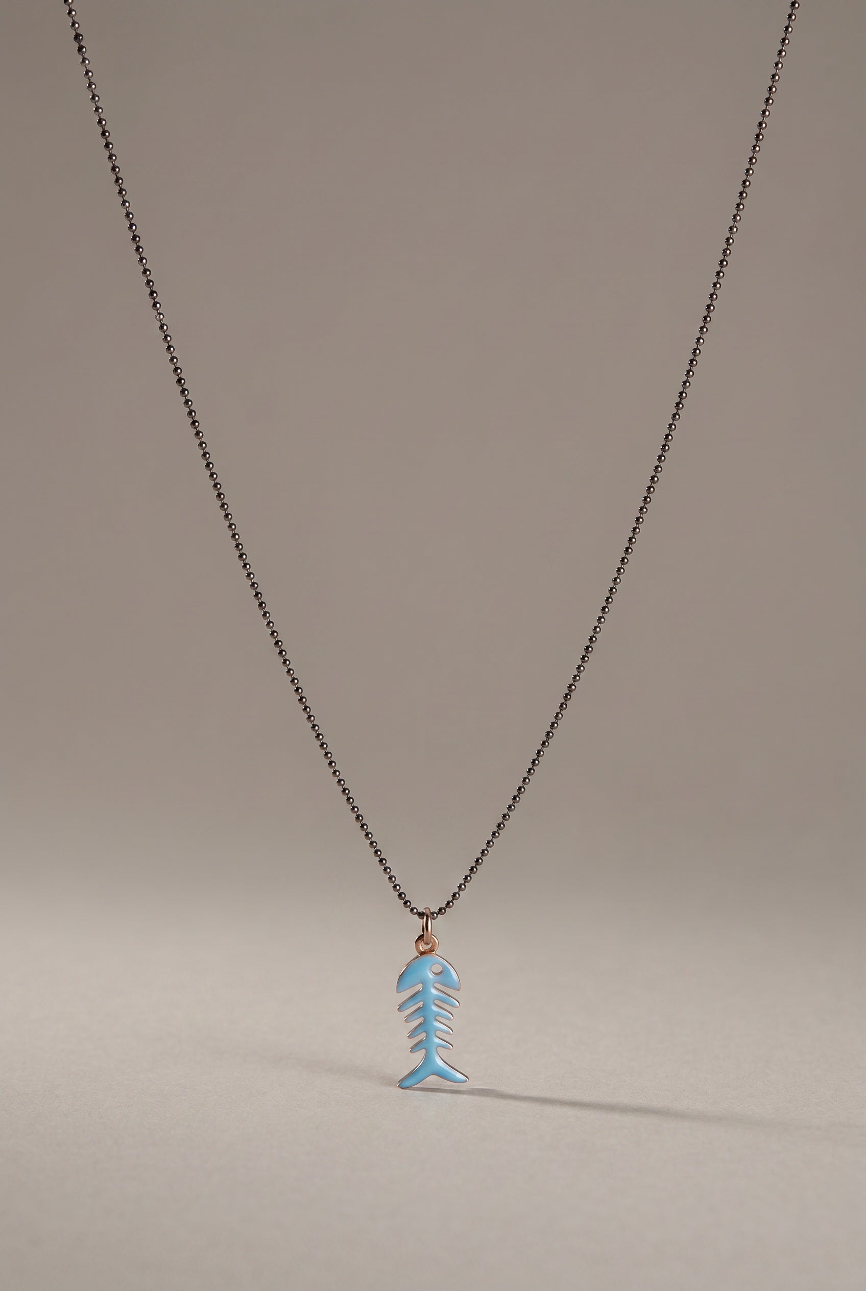 Sterling silver enamel fish necklace for a young man