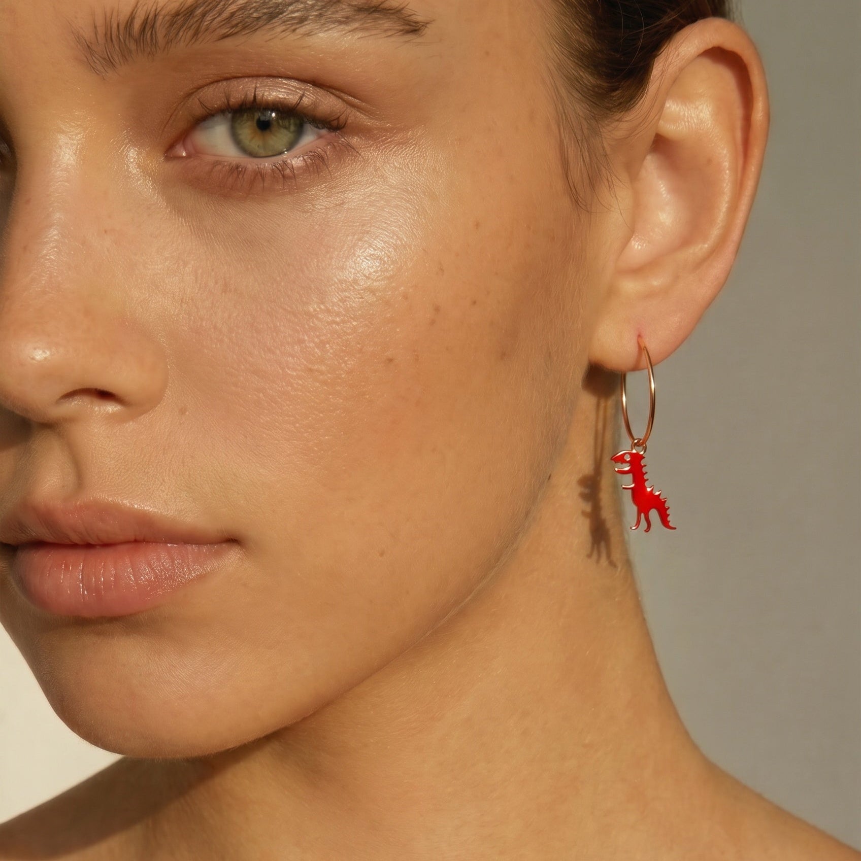 Women's red enamel dinosaur earrings in 18kt yellow gold